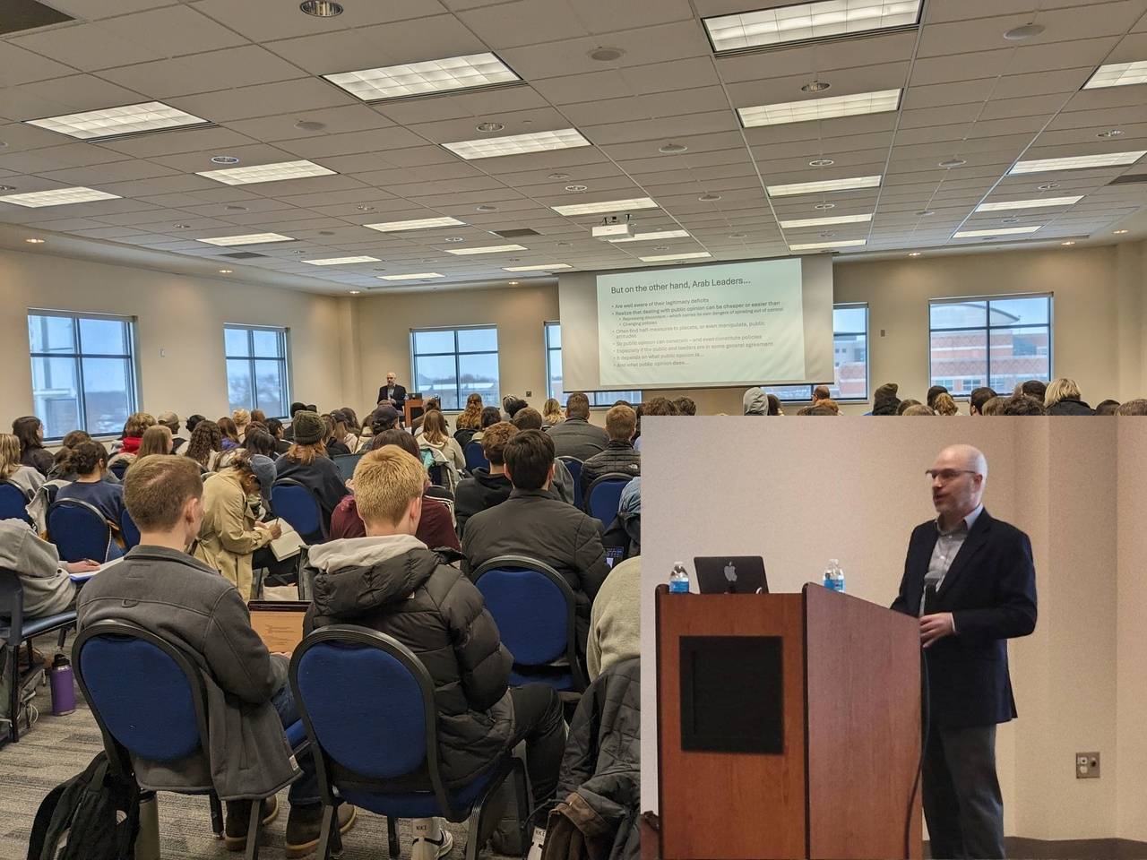 group of people listening to a lecturer